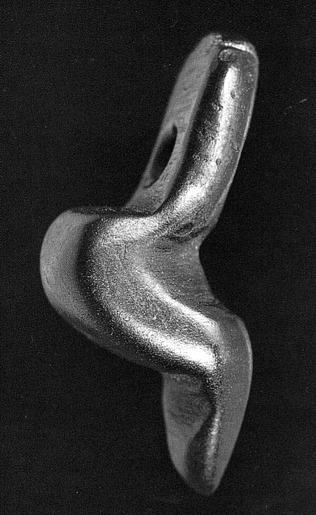 Statuette de la Dame de Monruz, petite représentation féminine préhistorique en jais découverte près de Neuchâtel